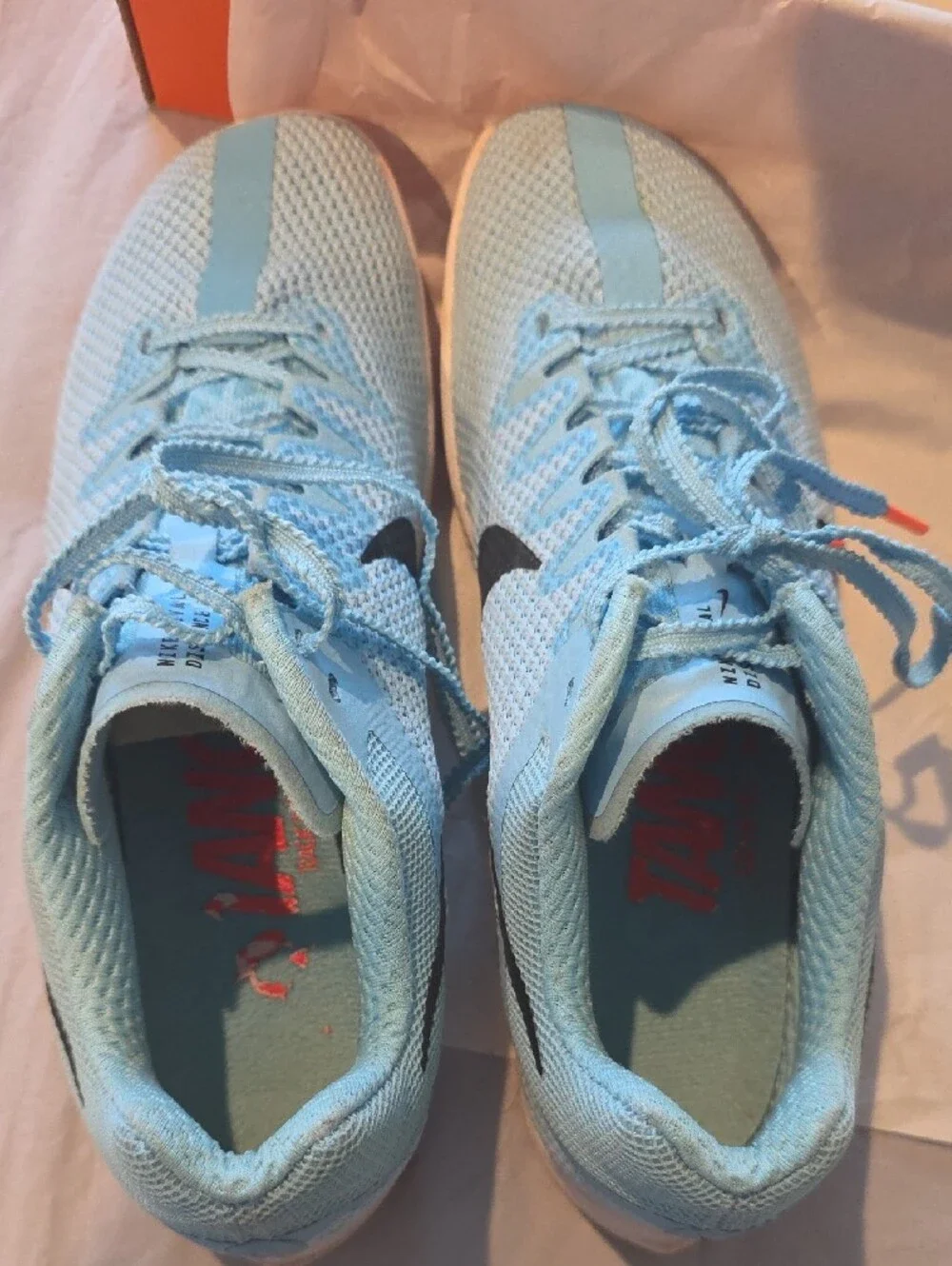 Nike Women's Light Blue Mesh Running Shoes with Black Swoosh